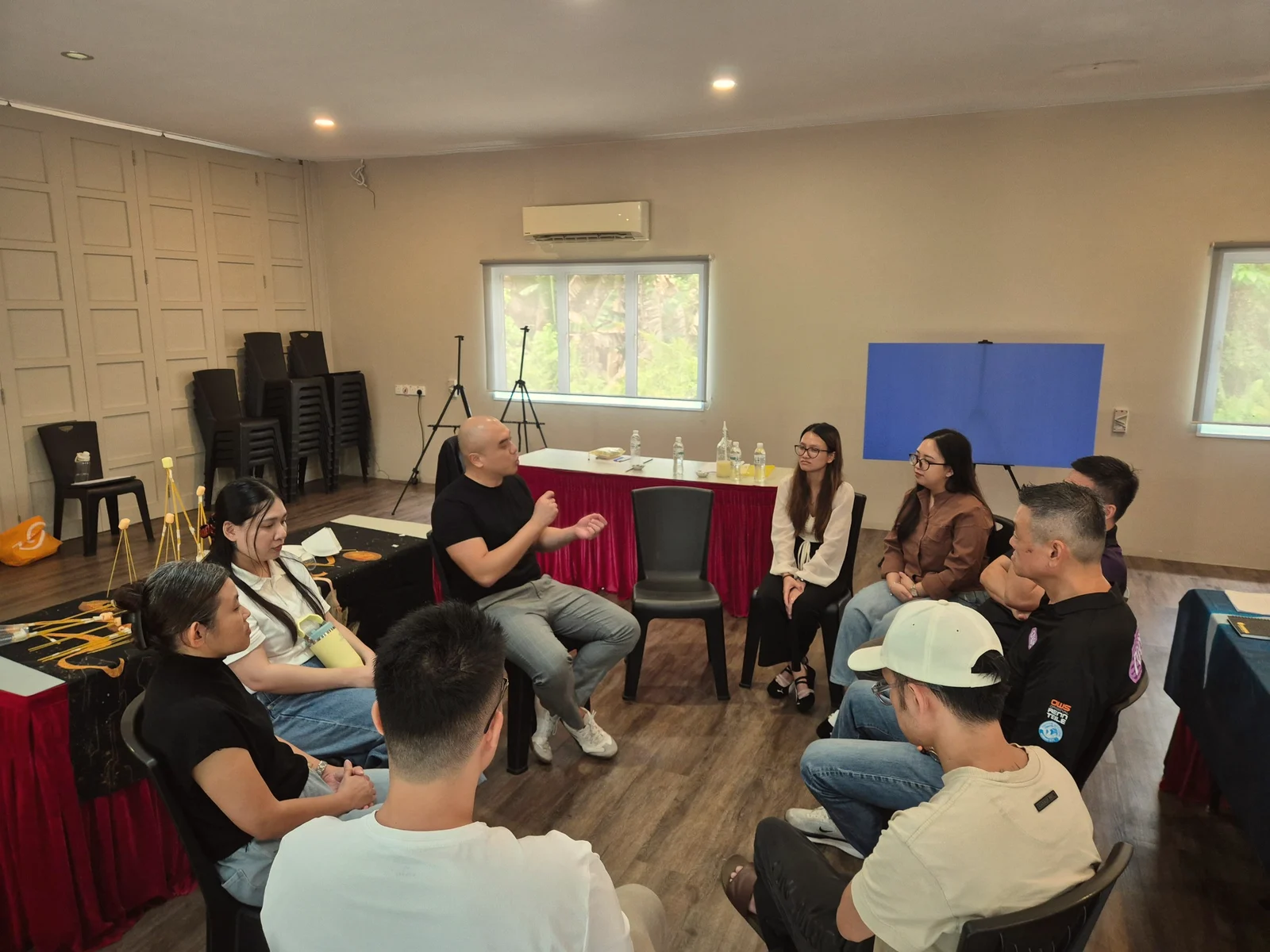 Zhi-Harn in a small-group sharing circle